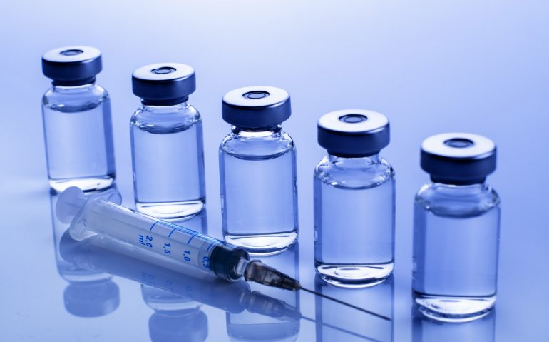 vaccine dose flu shot along with syringe